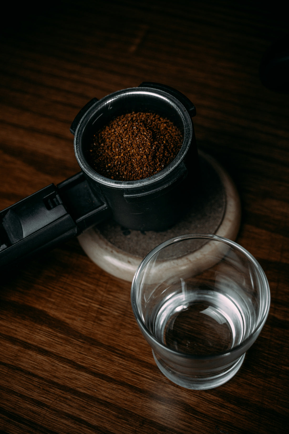 clear drinking glass on brown wooden table