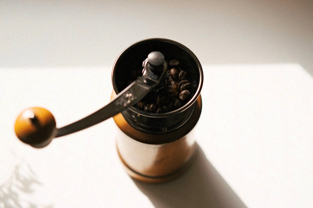 a coffee cup with a spoon sticking out of it