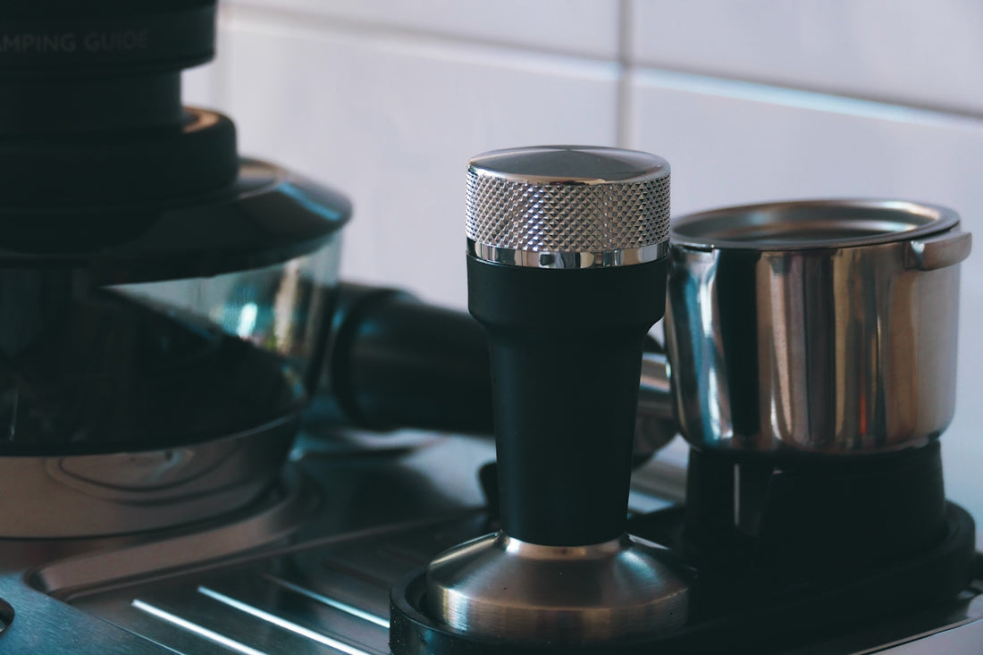 a close up of a coffee maker on a stove
