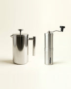The Brew Kit: Signature stainless steel French press and Precision manual burr grinder in brushed silver