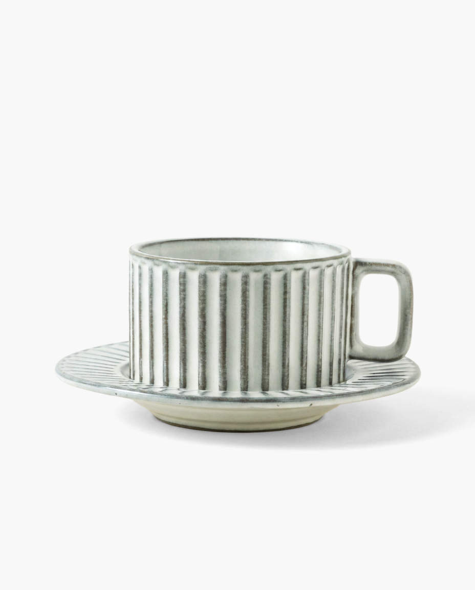 Vestige Kiln-Shift Mug in Fish Belly White, studio photo